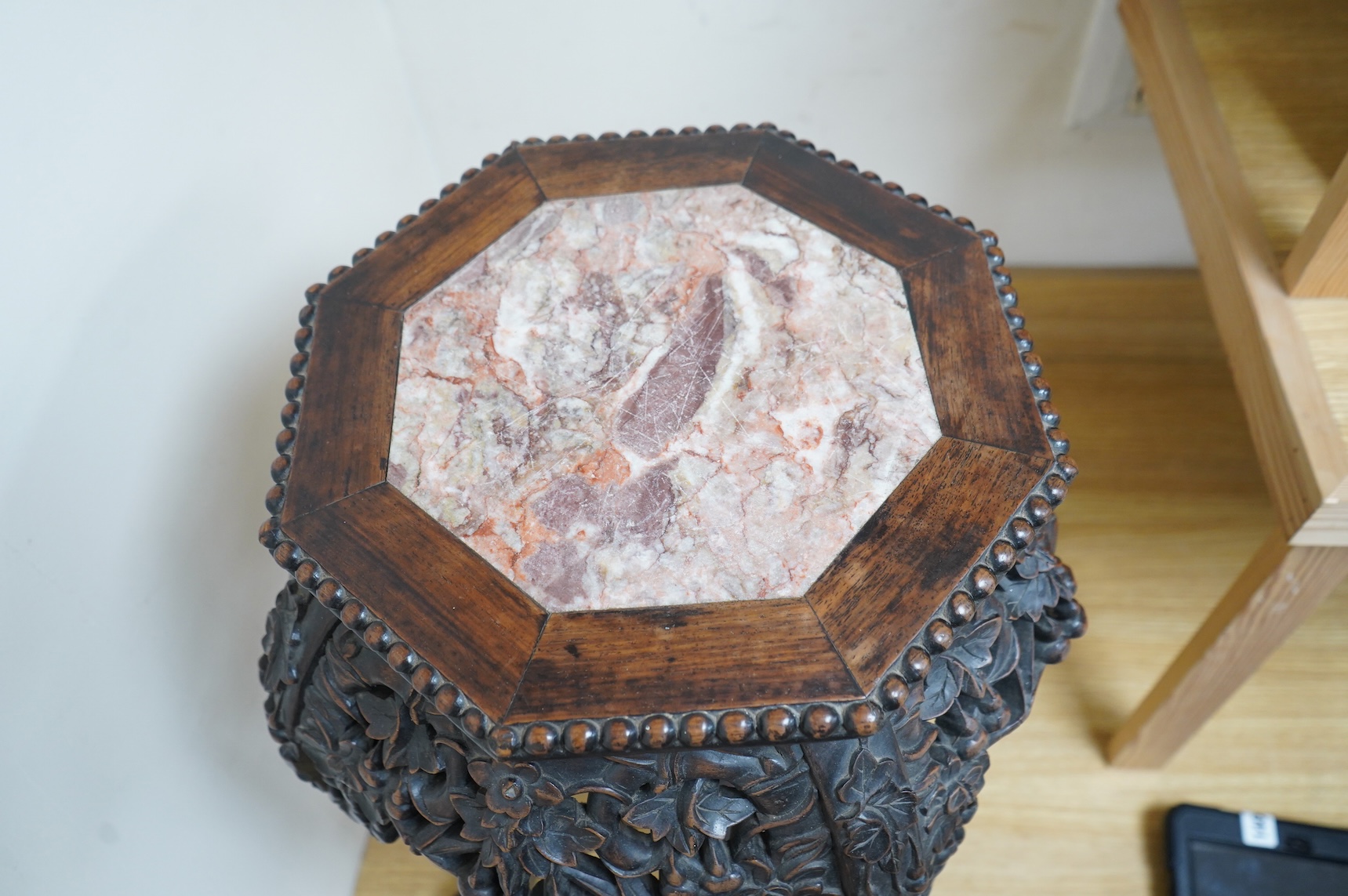 A late 19th/early 20th century Chinese marble inset hongmu jardinière stand, 60cm